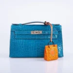 Hermès Kelly Pochette Blue Izmir Shiny Alligator Mississippiensis Palladium Hardware Lushentic Replica